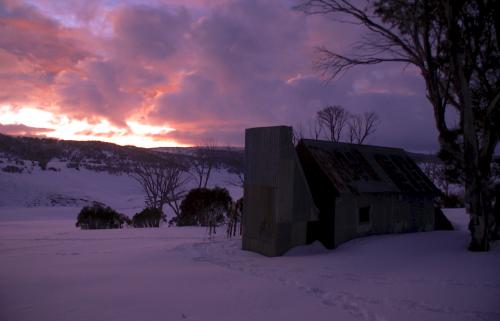 Grey Mare Hut at sunrise with the weather moving in
